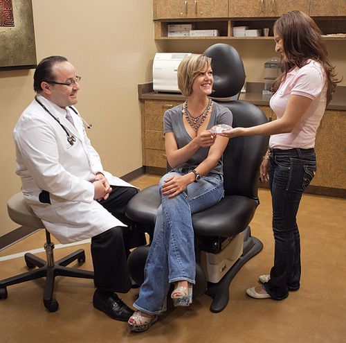 Dr. Guerra in post-operative recovery room with patient